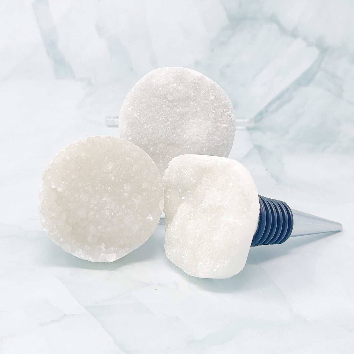 Wine bottle stopper with white stone on a light blue background