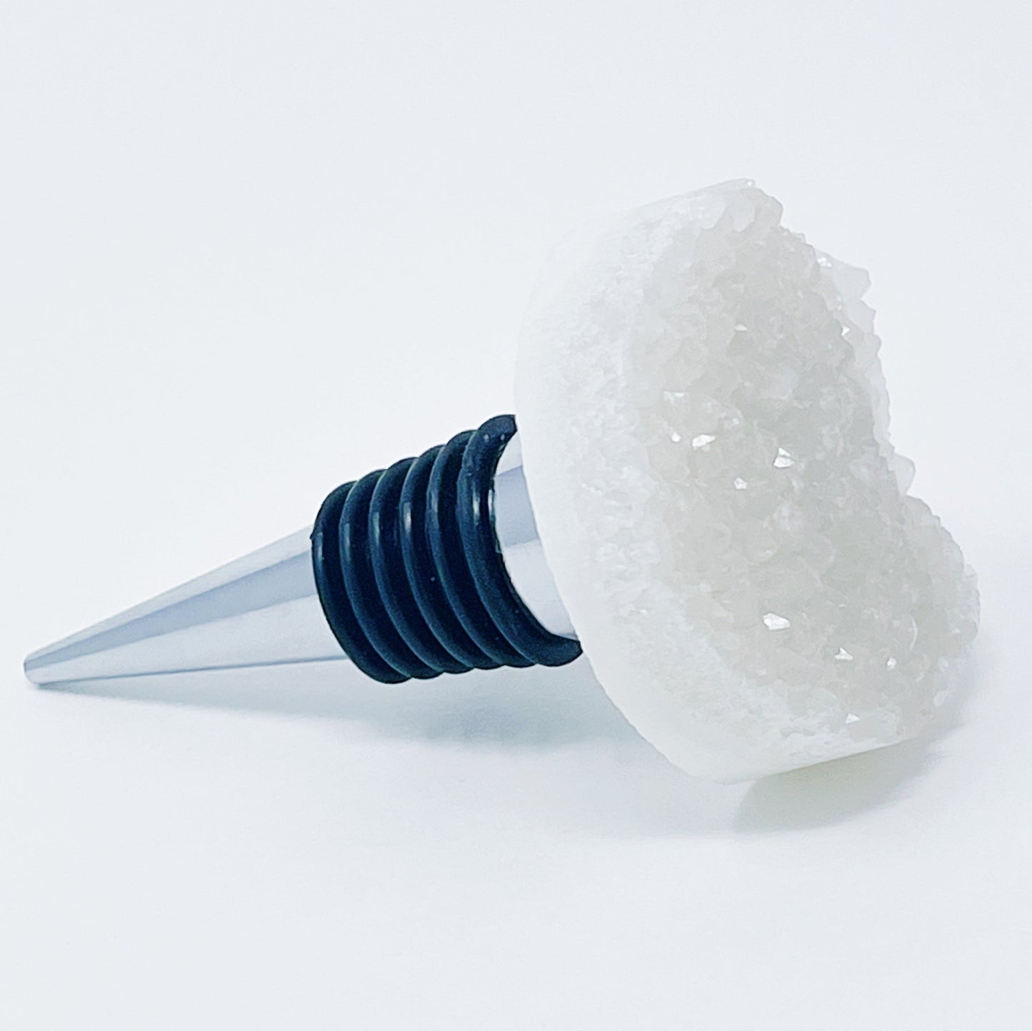 Clear crystal bottle stopper on a white background