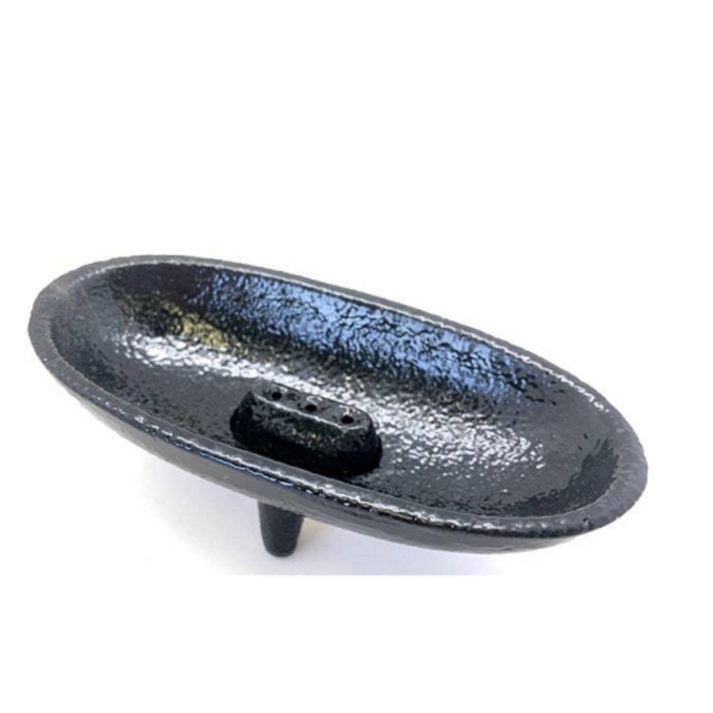 Black cast iron smudging dish on a white background