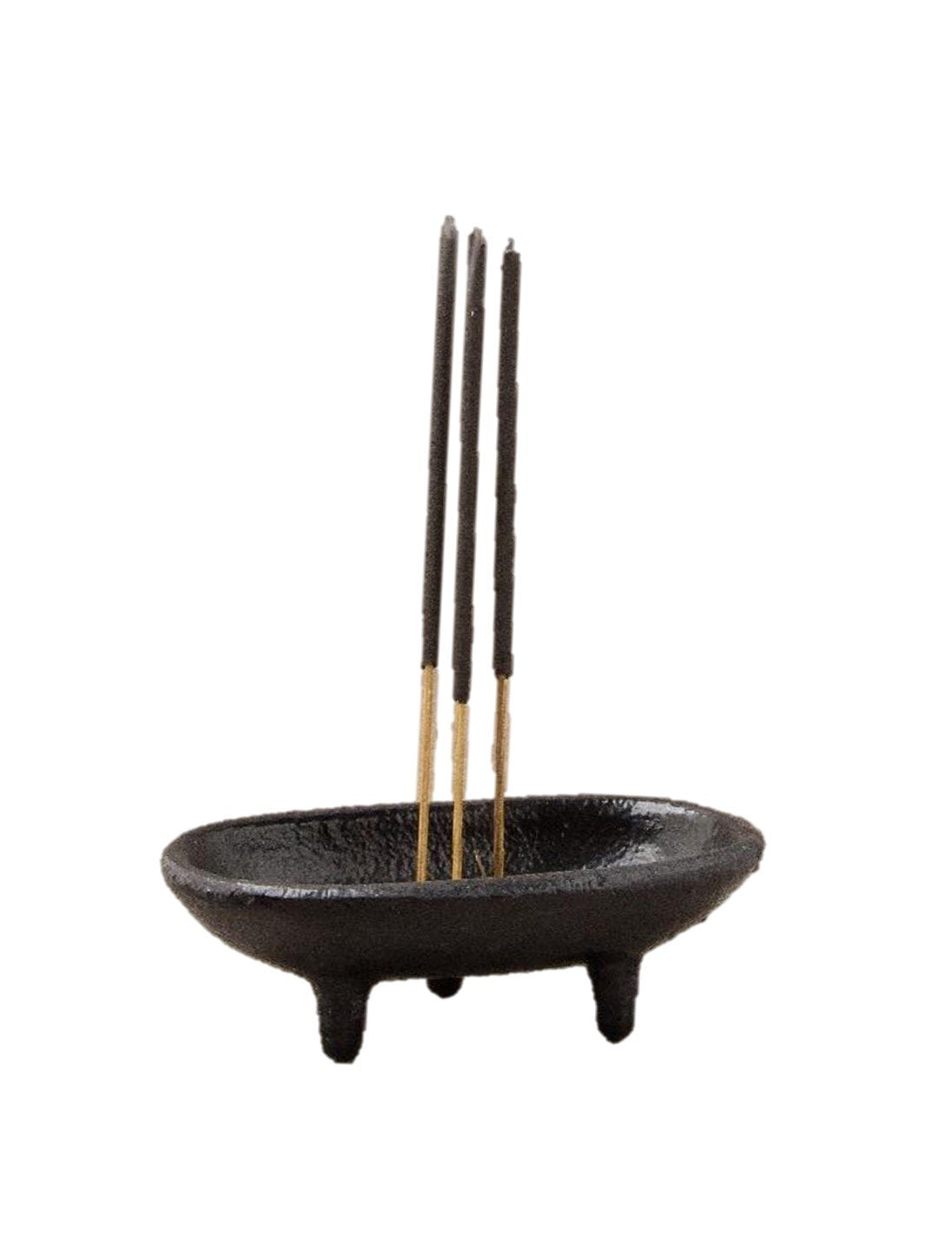Black incense burner with three incense sticks on a white background