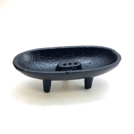 Black cast iron smudge pot on a white background