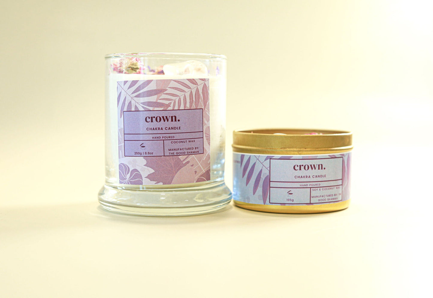 Two candles with 'crown.' labels on a light background