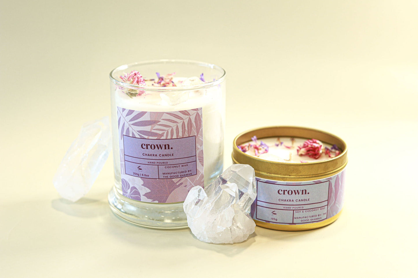 Two candles with 'crown.' branding on a light background