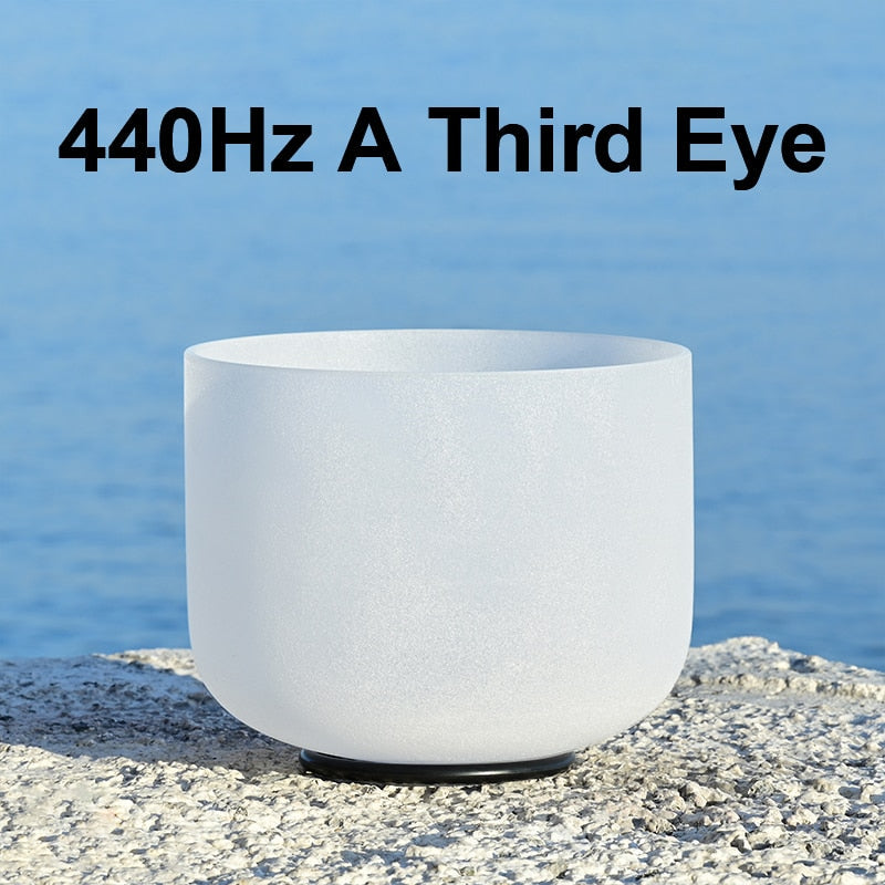 White crystal singing bowl with text '440Hz A Third Eye' against a blue water background