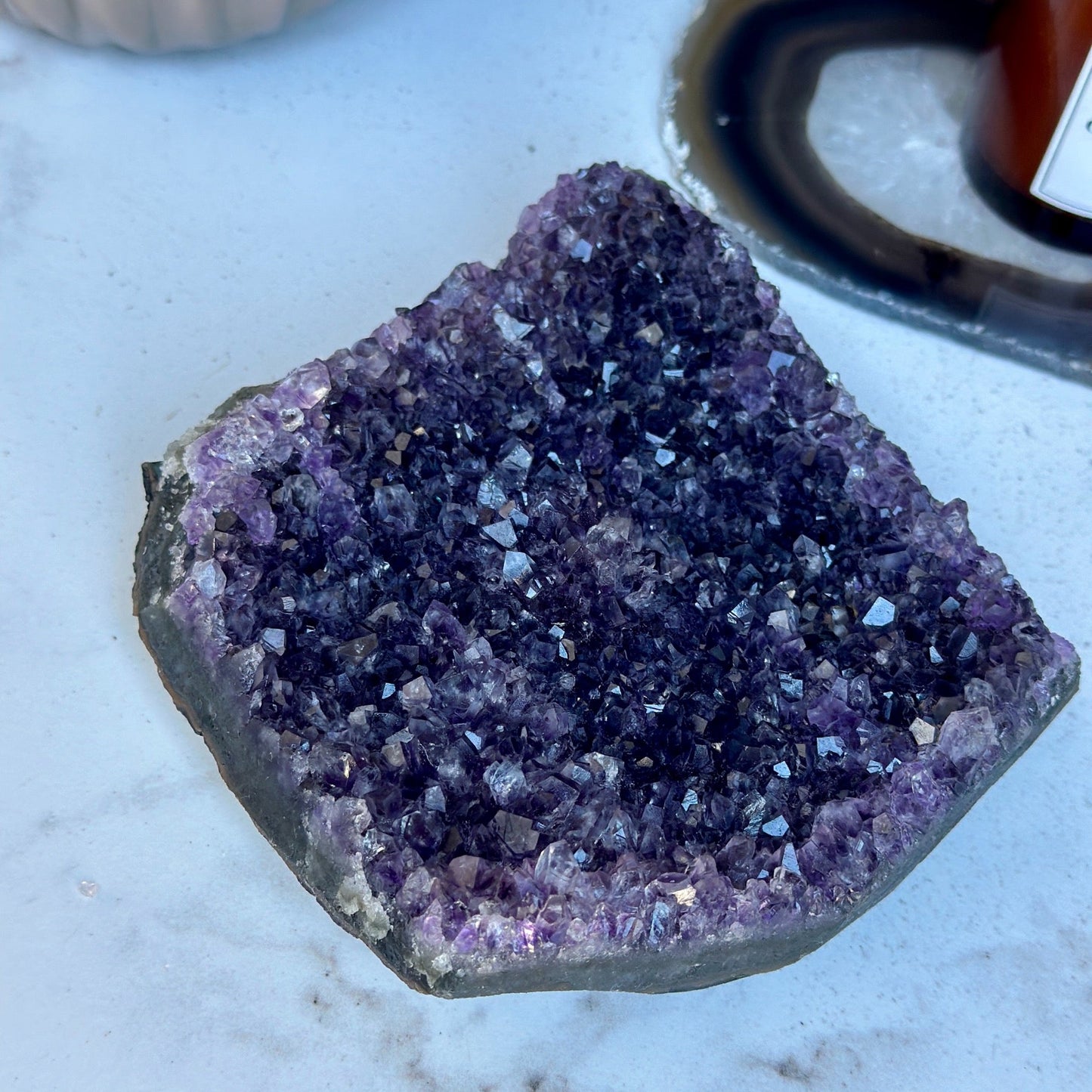 Flat amethyst crystal cluster