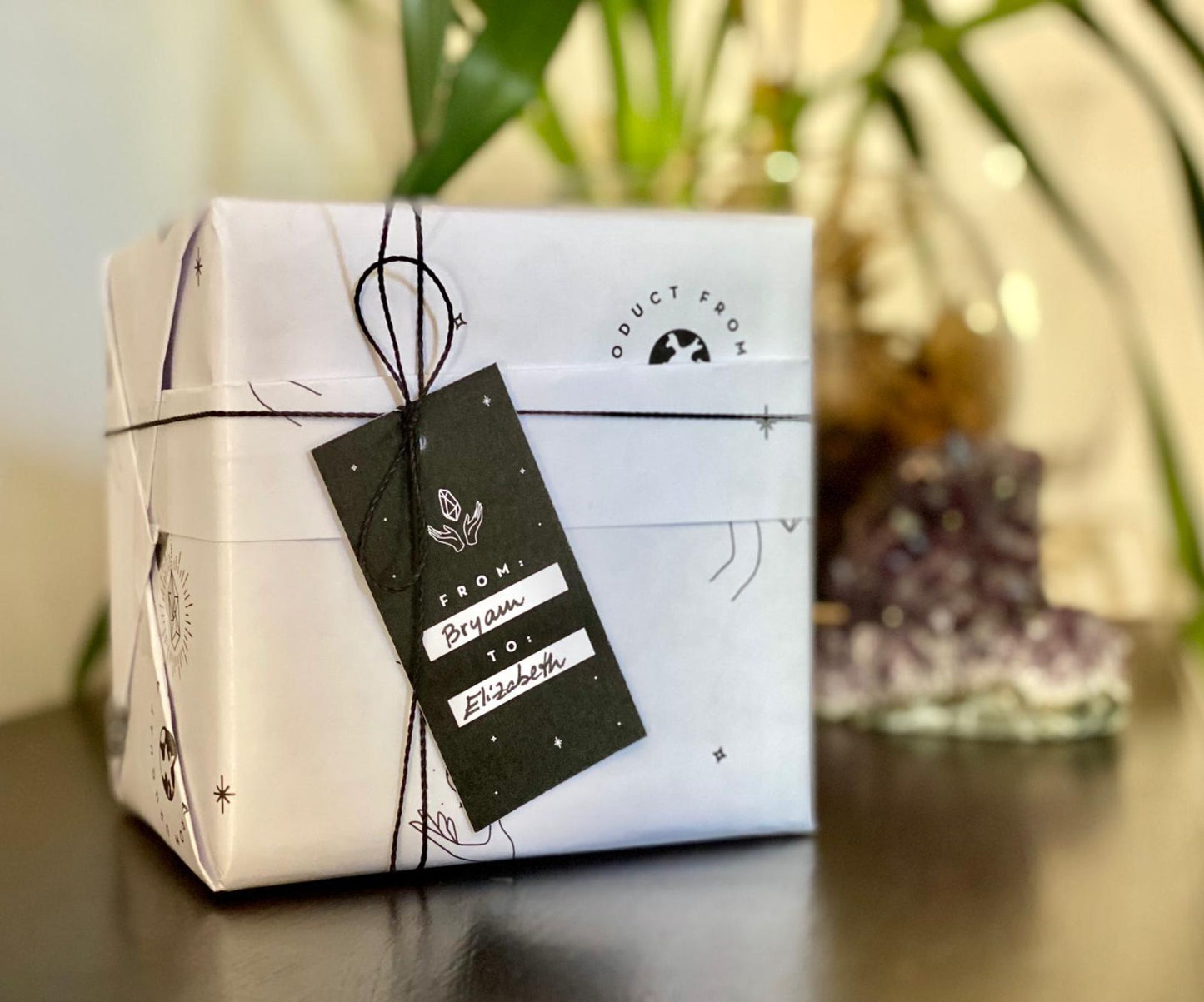 Gift box with a black tag on a blurred background