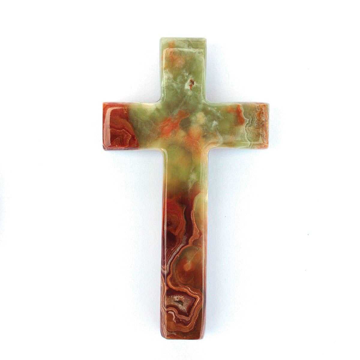 Decorative hand carved onyx cross with a marbled pattern on a white background