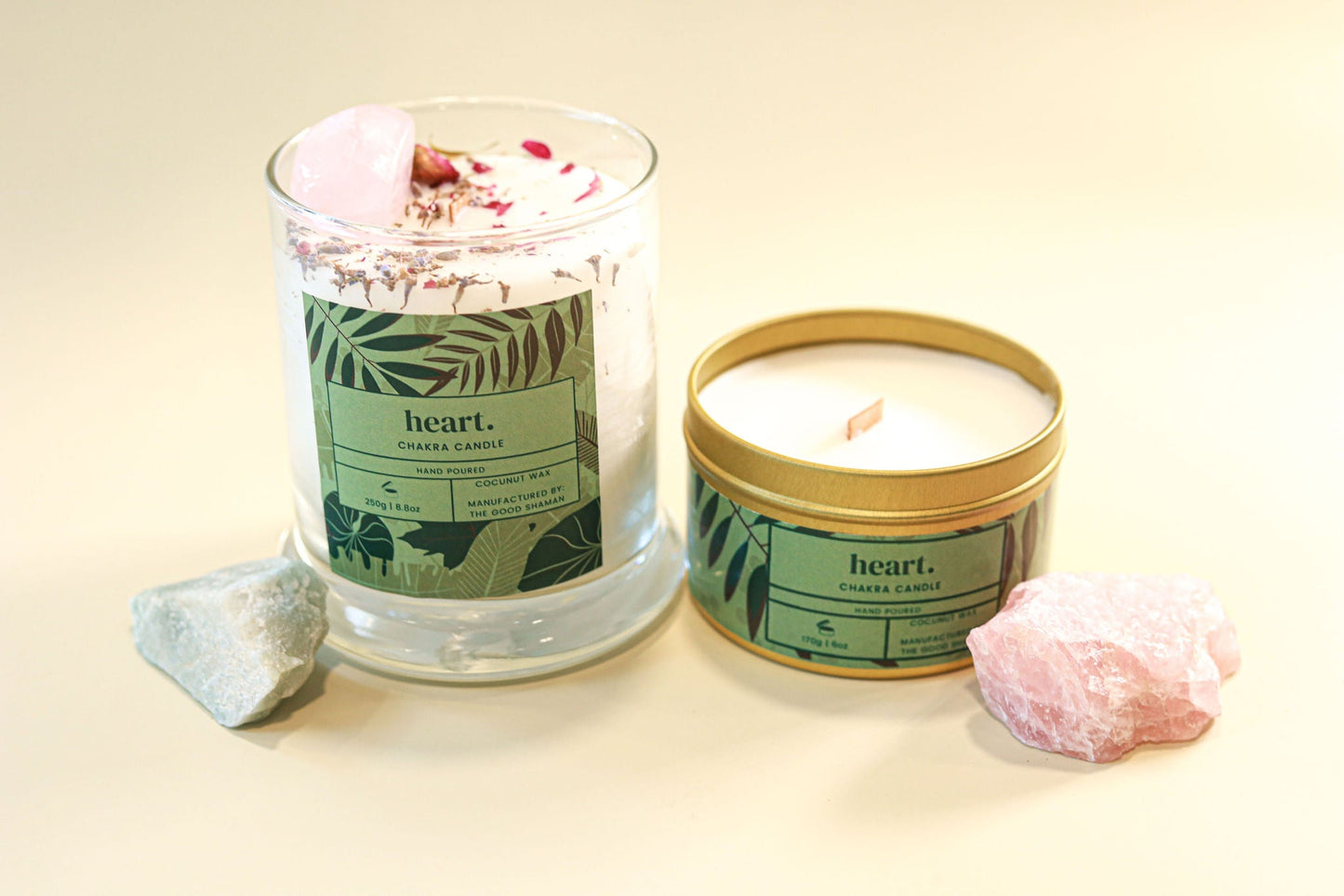 Two candles with 'heart.' branding on a light background