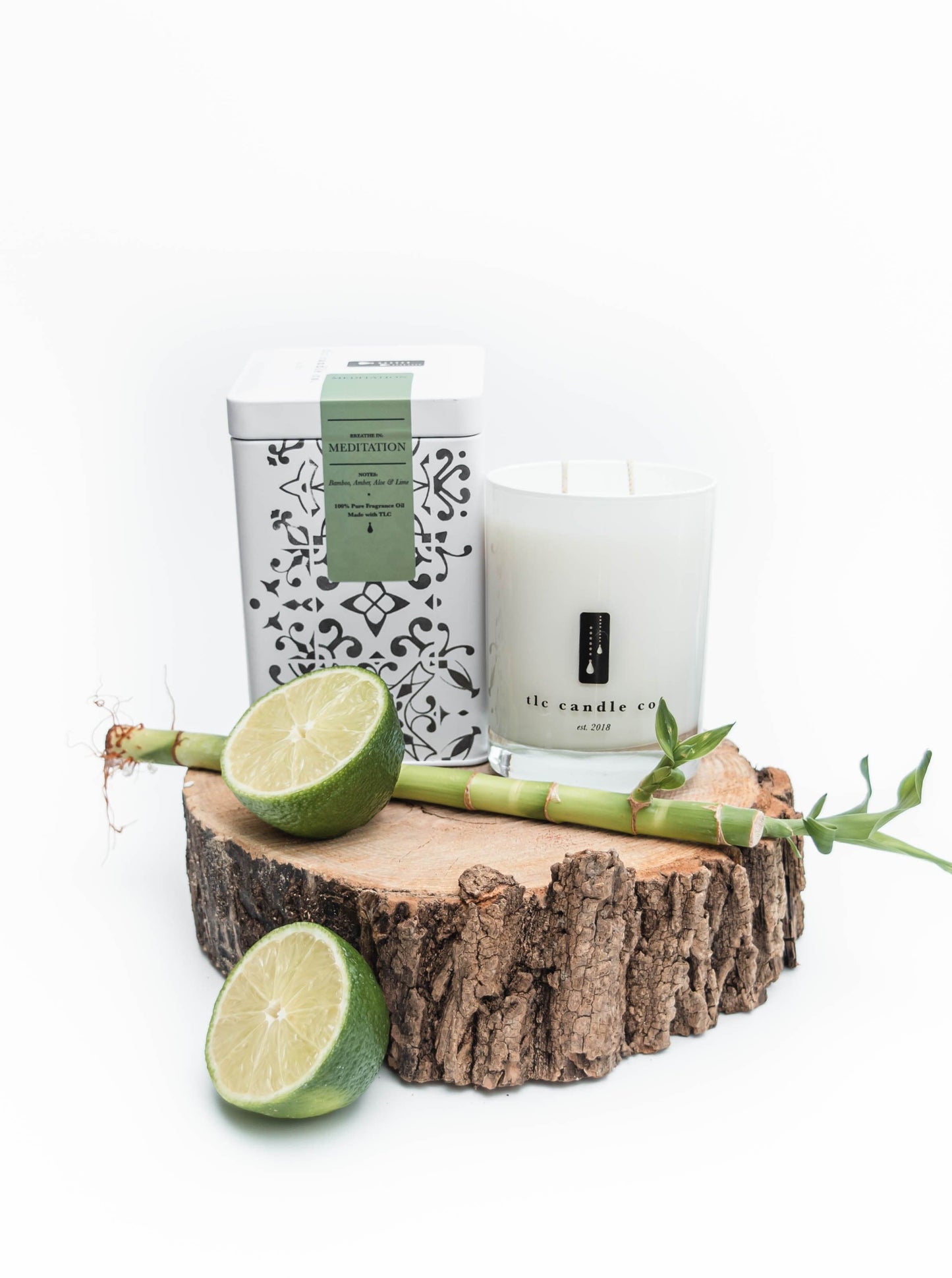 Candle on a wooden block with a white background