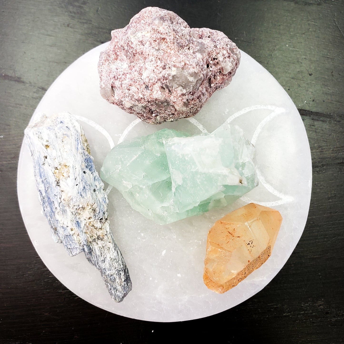 Crystals on a selenite plate with a dark background