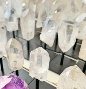 Close-up of crystal stones on stands with a blurred background