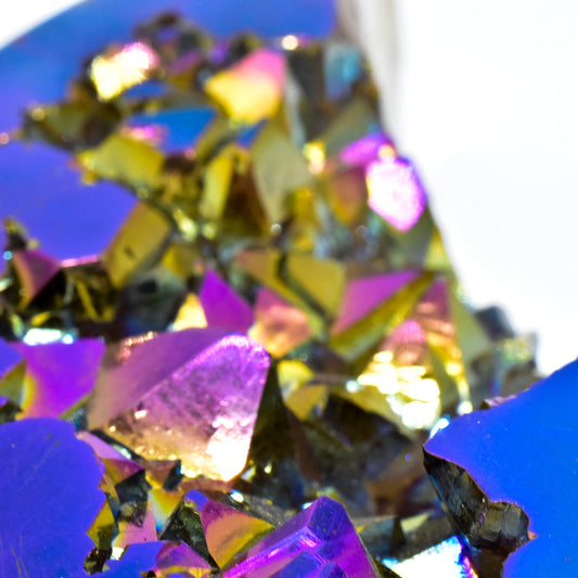 Close-up of colorful, rainbow agate against a blue background
