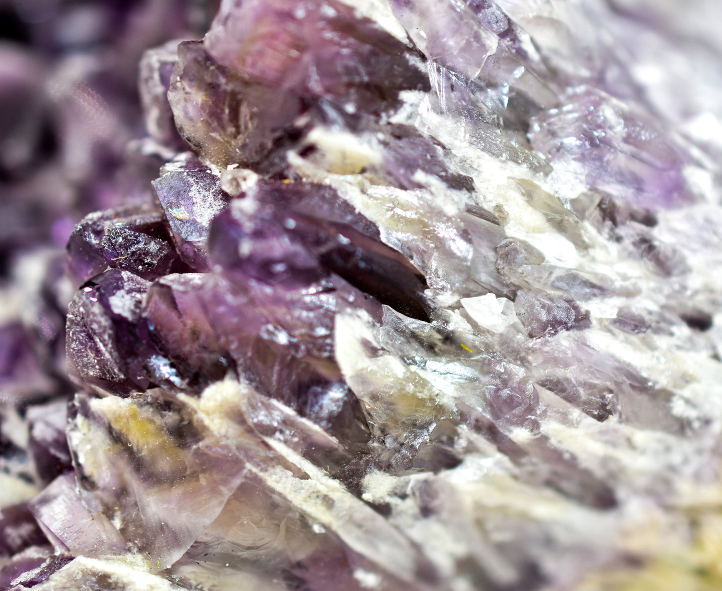 Close-up of purple crystal formation on a white background