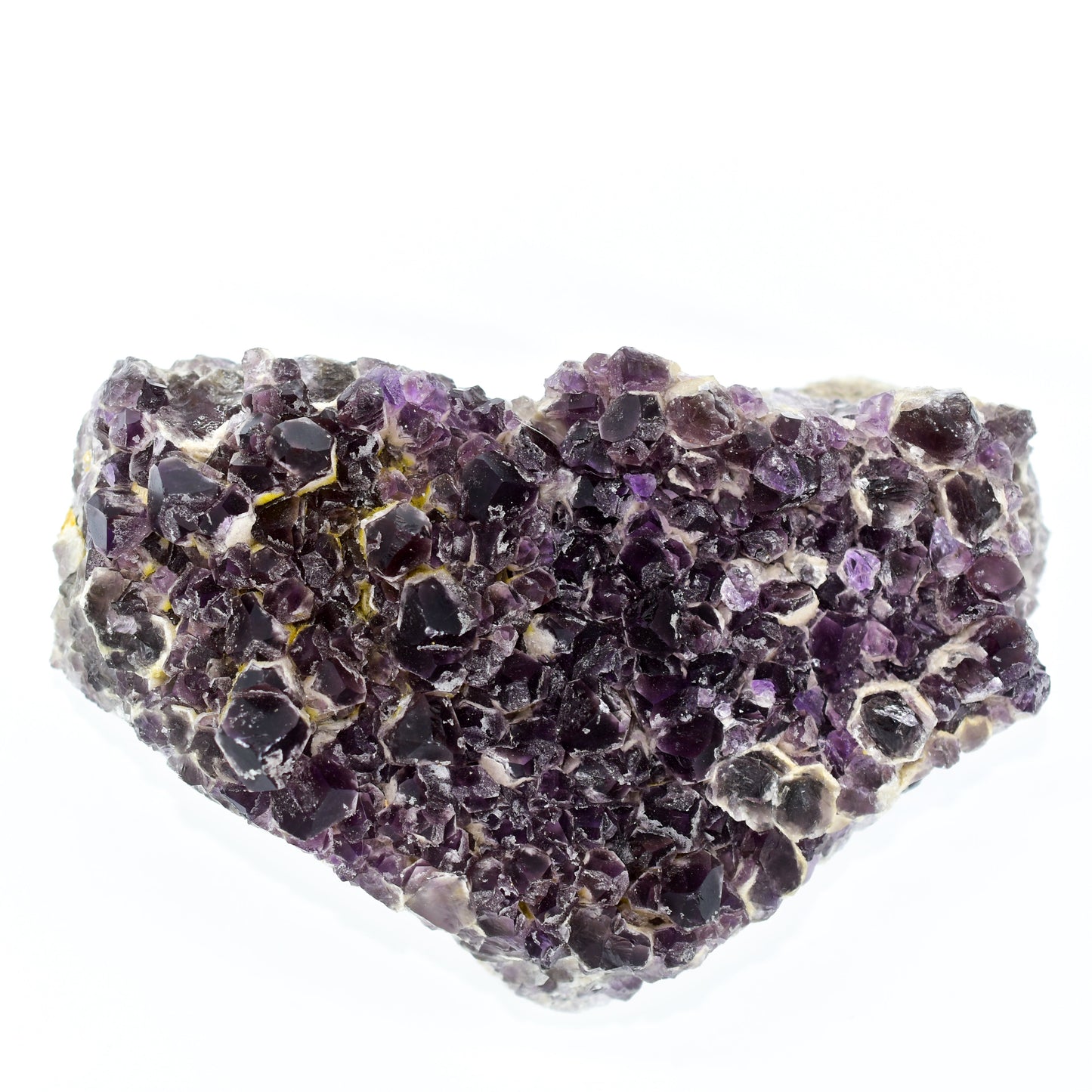 Amethyst crystal cluster on a white background
