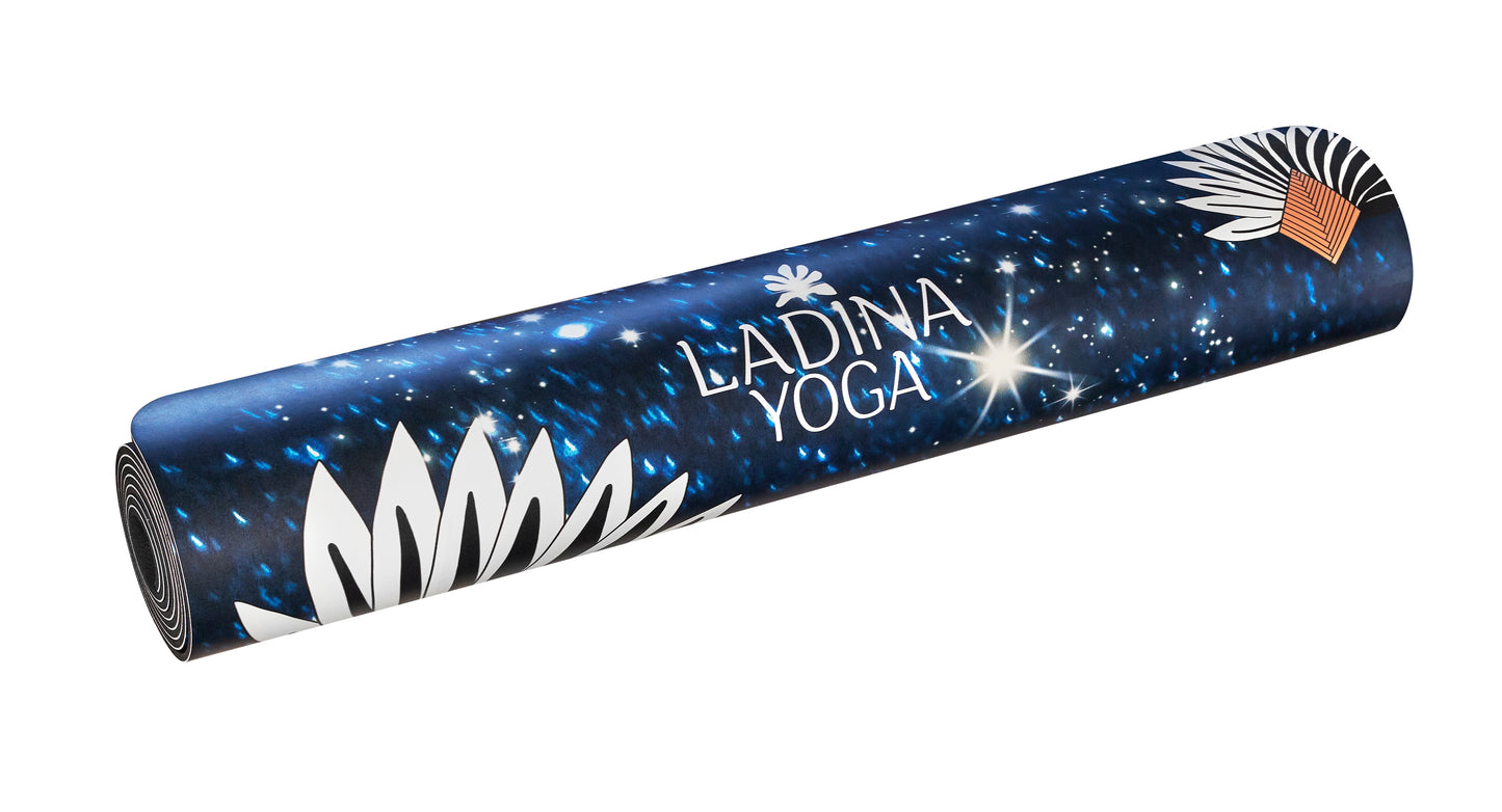 Yoga mat with starry night design branding on a white background