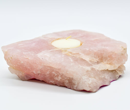 Rose quartz candle holder on a white background