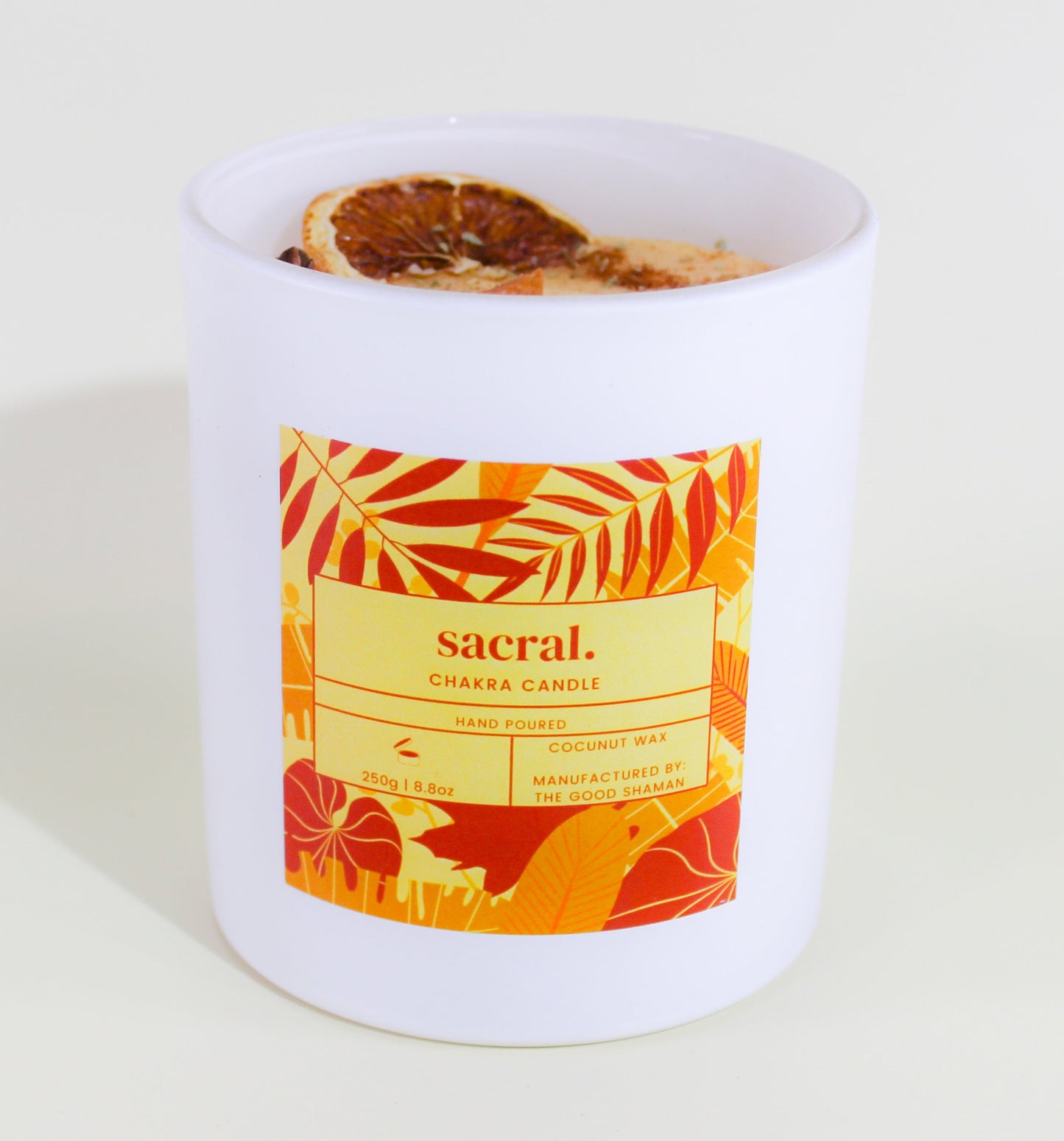 Candle with a colorful label on a white background