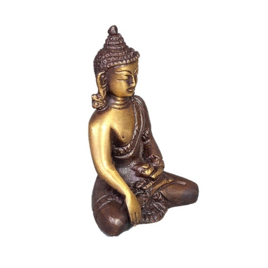 Bronze and gold Buddha statue on a white background