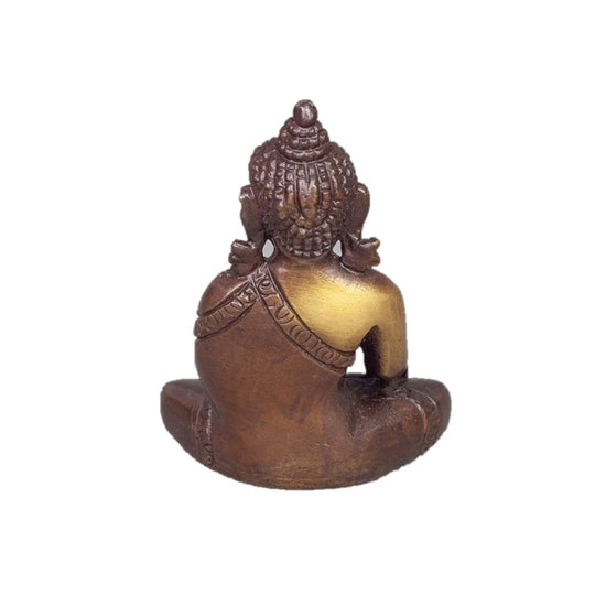 Back view of bronze-colored Buddha statue on a white background