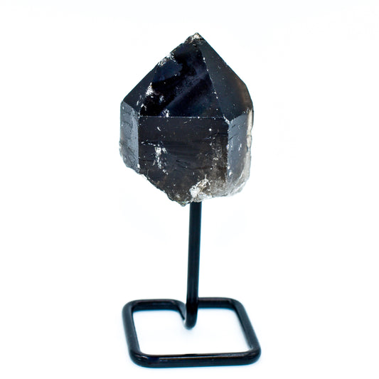 Smokey Quartz crystal on a stand against a white background