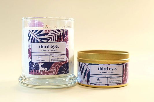 Two candles with 'third eye' branding on a beige background