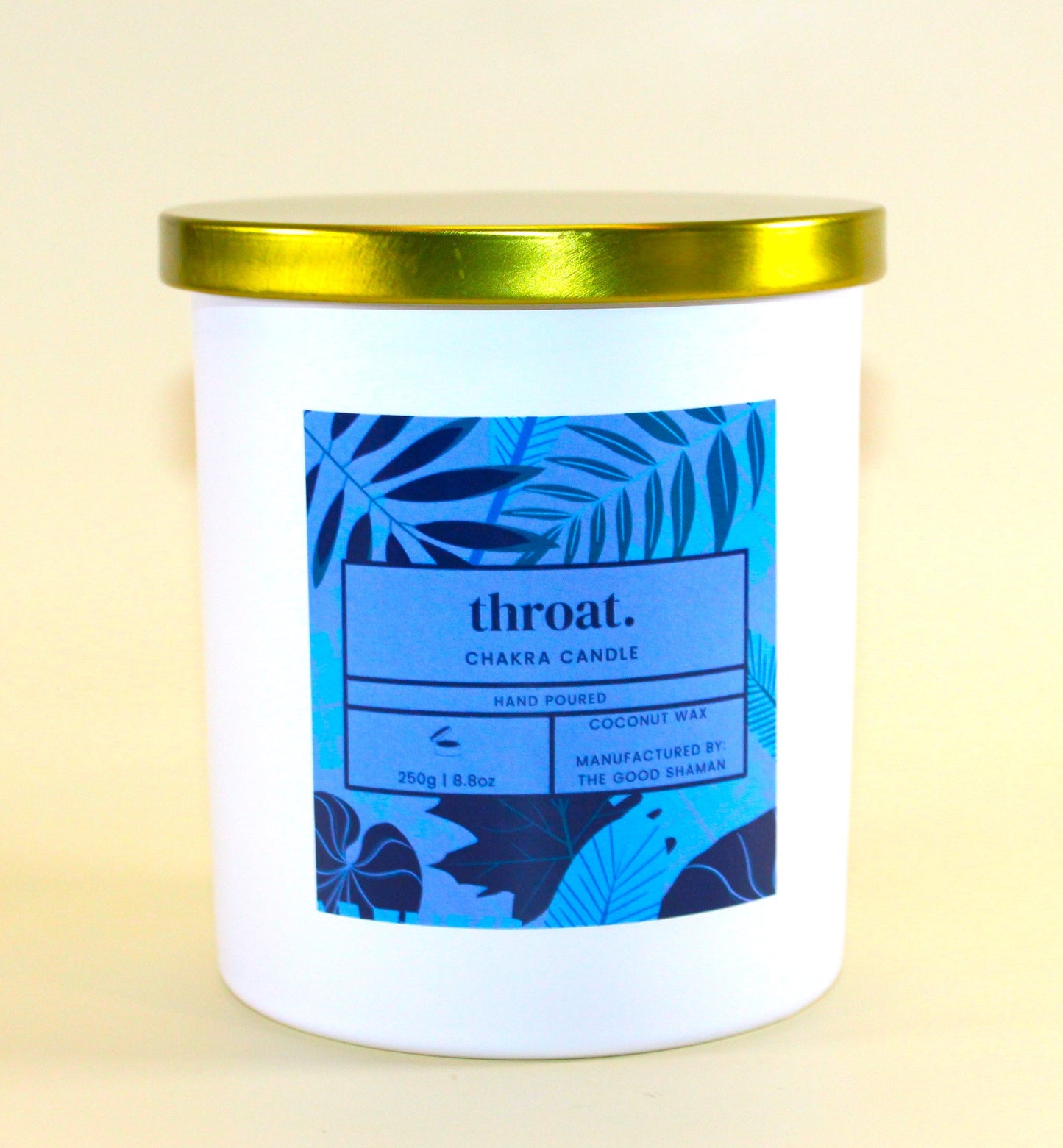 Candle with a blue label on a beige background