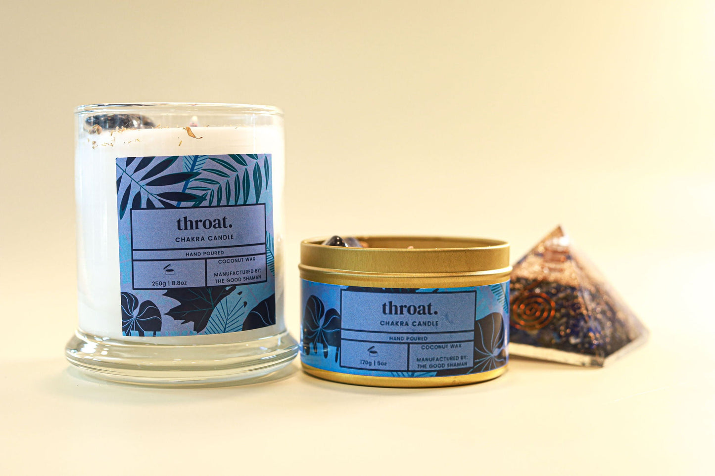 Candle and container with 'throat.' label on a beige background