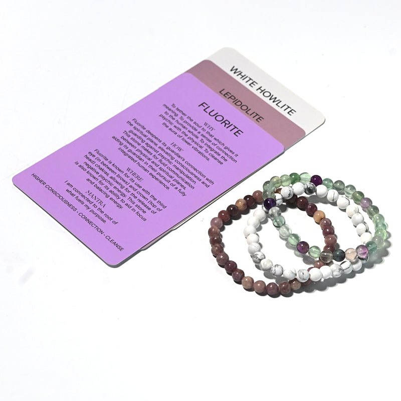 Set of beaded bracelets on a card with text