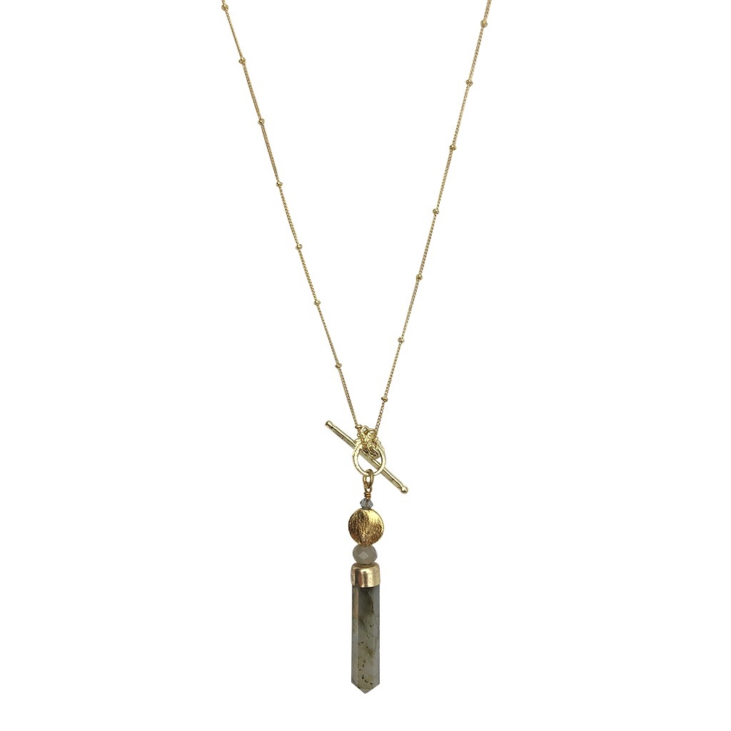 Necklace with a tassel pendant on a white background