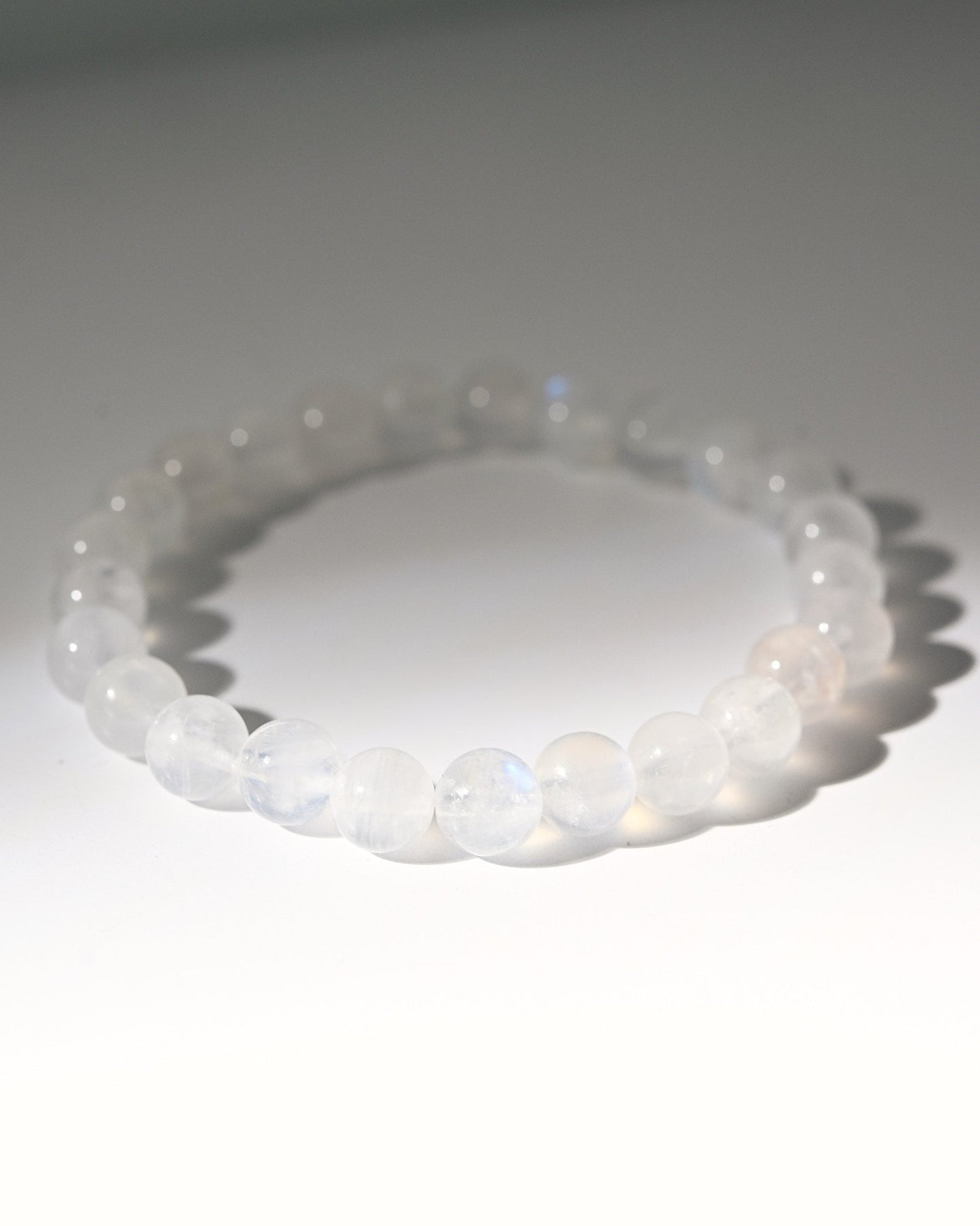 White moonstone beaded bracelet on a white background