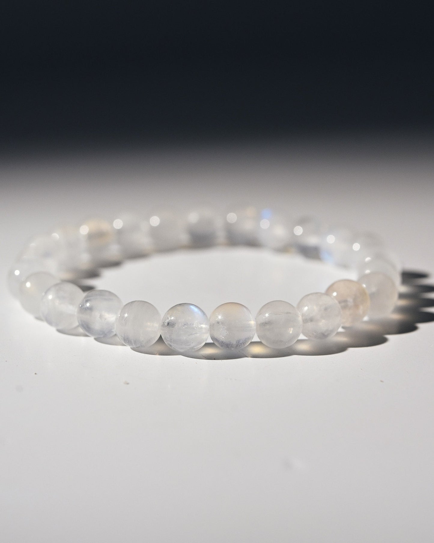 White moonstone beaded bracelet on a white background