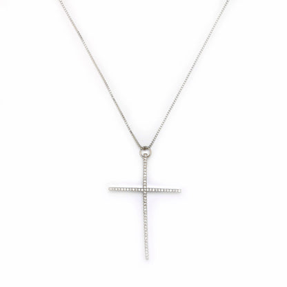 Silver cross necklace on a white background