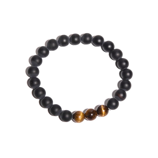 Black beaded bracelet with two brown beads on a white background