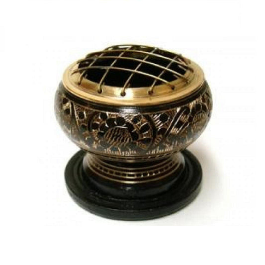 Decorative incense burner with intricate designs on a white background