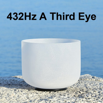 White crystal singing bowl with text '432Hz A Third Eye' against a blue water background