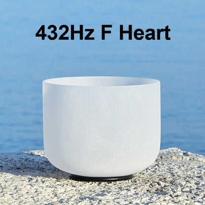 White singing bowl labeled '432Hz F Heart' on a blue water background