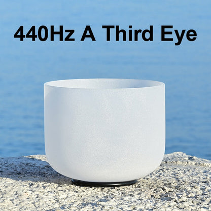 White crystal singing bowl with text '440Hz A Third Eye' against a blue water background