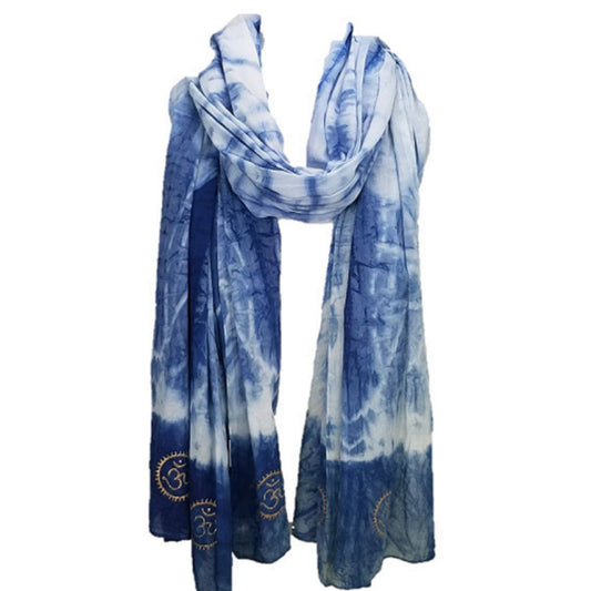 Blue and white tie-dye scarf with embroidered designs on a white background