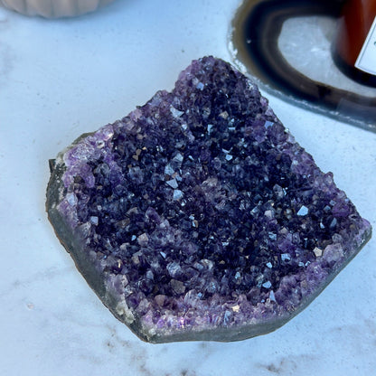 Flat amethyst crystal cluster 