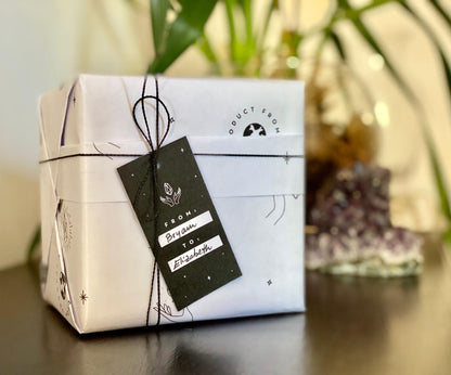 Gift box with a black tag on a blurred background