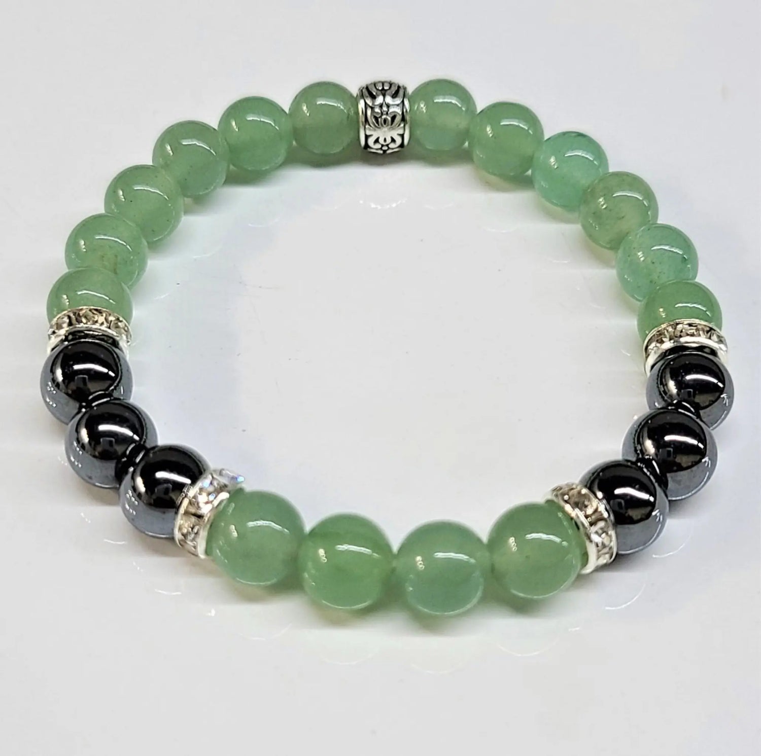 Green Aventurine and Hematite beaded bracelet on a white background