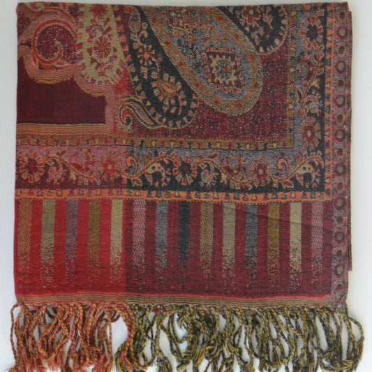Colorful patterned shawl with fringes on a white background