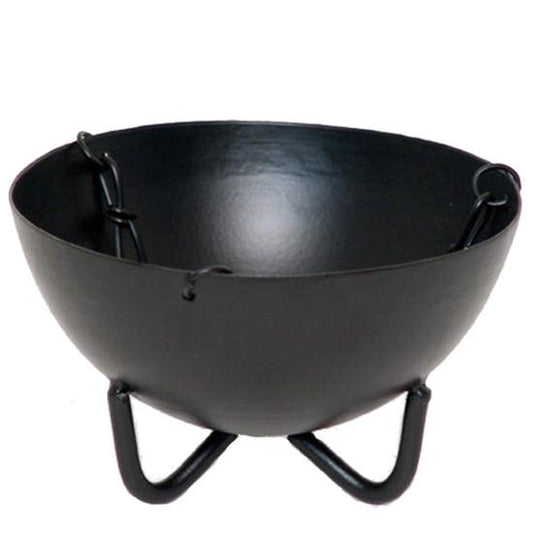Black metal cauldron for smudging with stand on a white background