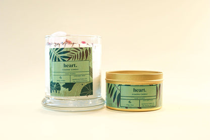 Two candles with 'heart.' branding on a light background