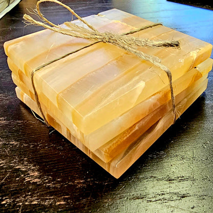 Stack of coasters tied with twine on a wooden surface