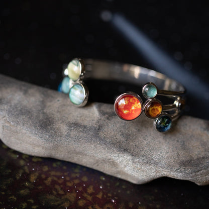 Colorful gemstone bracelet on a dark stone surface