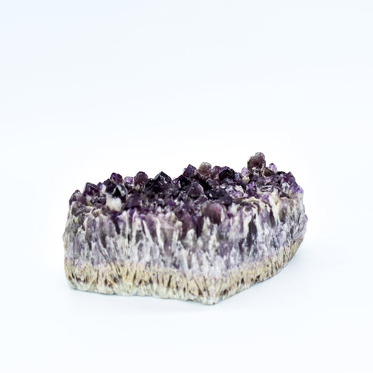 Amethyst crystal cake on a white background