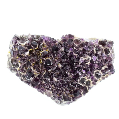 Amethyst crystal cluster on a white background