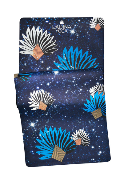 Yoga mat with starry night design on a white background