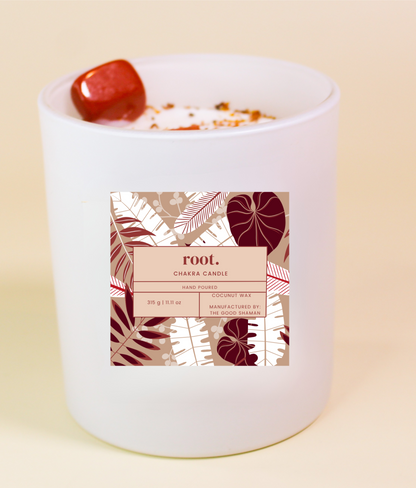 Root Chakra Candle with a decorative label on a beige background